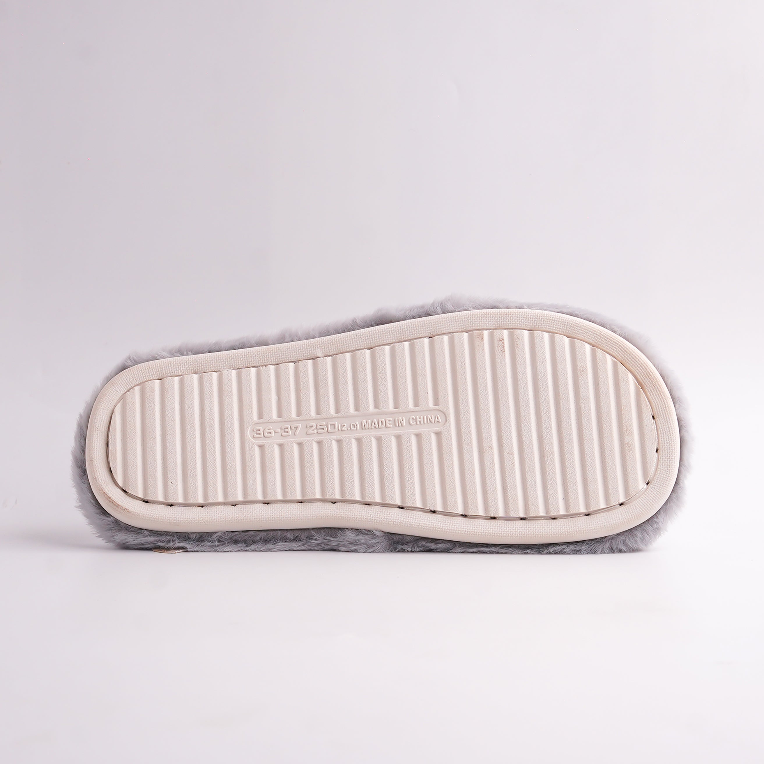 backside view of Gray Faux Fur Slides with white embroidered 'HOME WARM' cross-straps, cozy slippers.