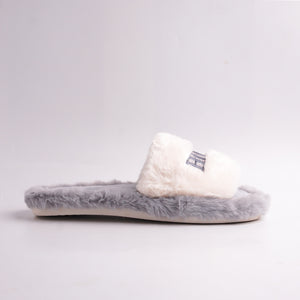 White ridged anti-slip sole of Gray Faux Fur Slides, bottom view, durable indoor sole.