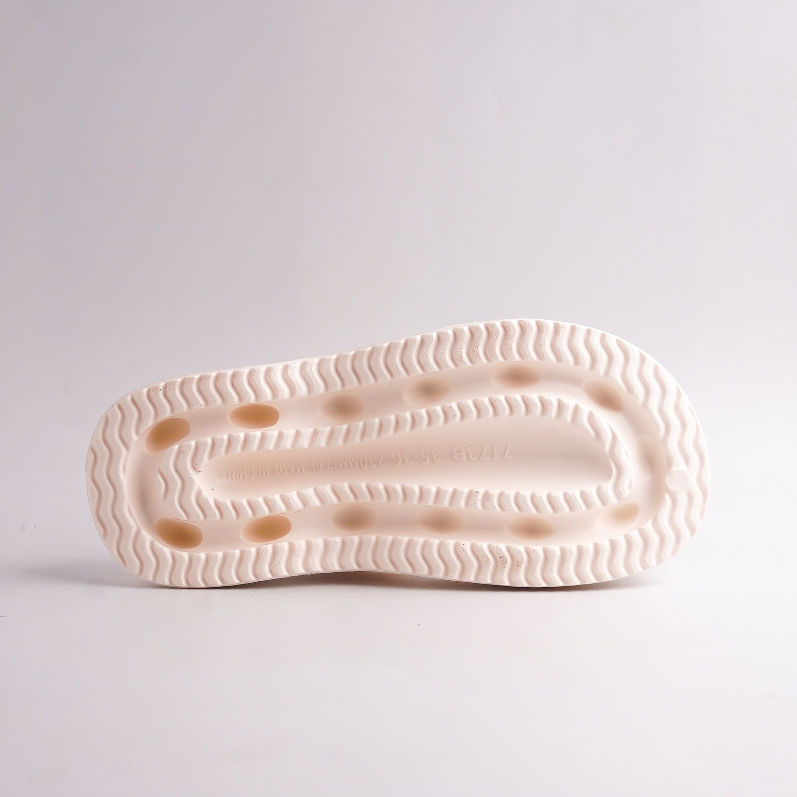 Bottom view of Cream Platform Thong Sandal showing the ridged, anti-slip sole.