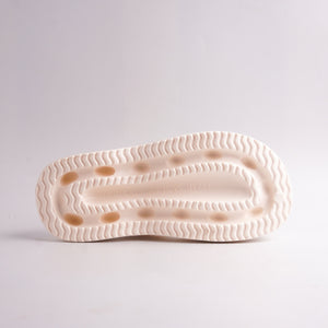 Bottom view of Cream Platform Thong Sandal showing the ridged, anti-slip sole.