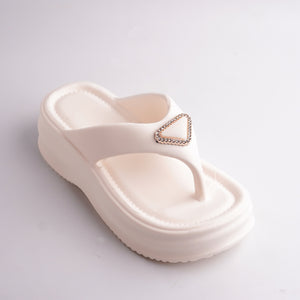 Close-up of the Cream Platform Thong Sandal showing the sparkling triangular jewel detail.