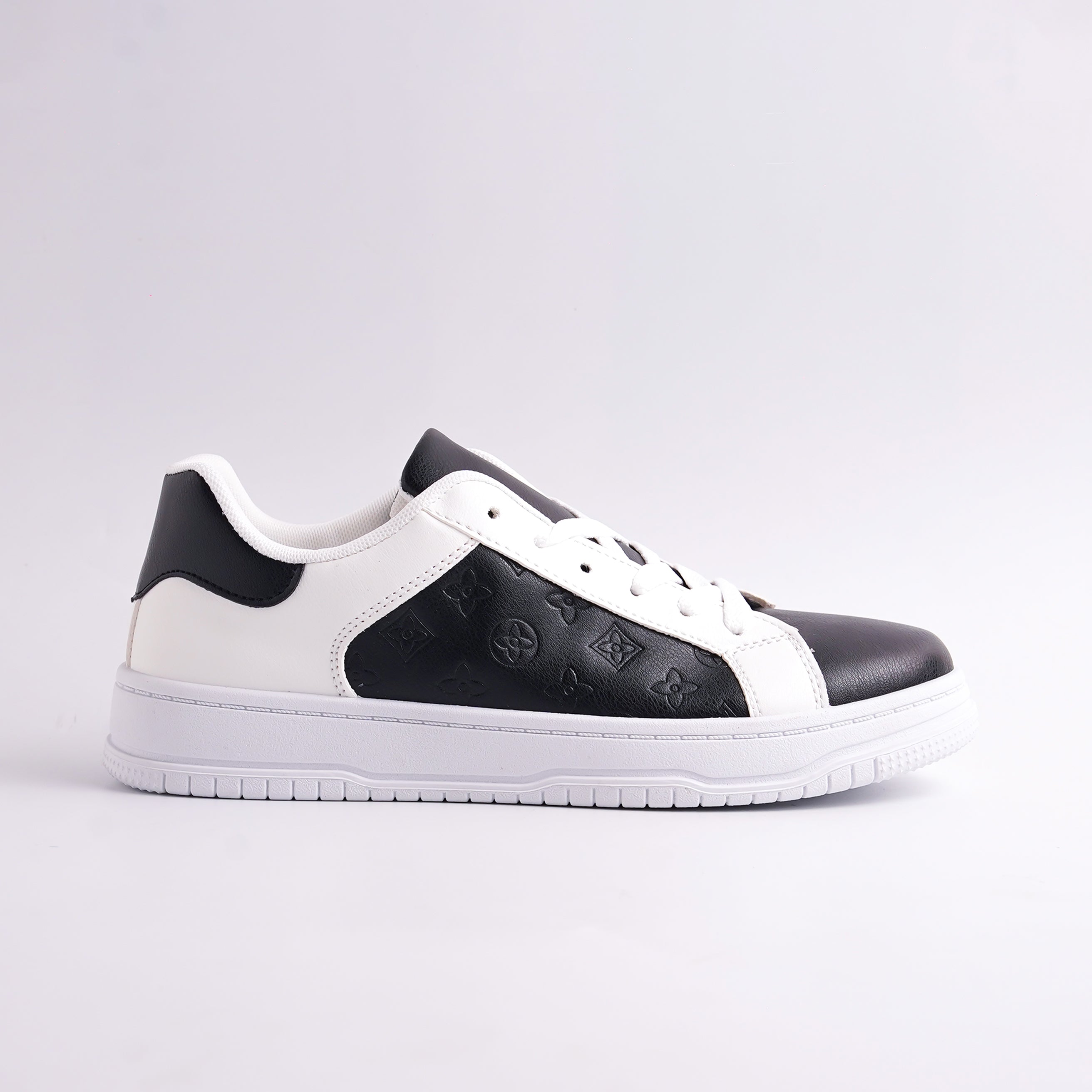 Black and white sneaker on a light gray background