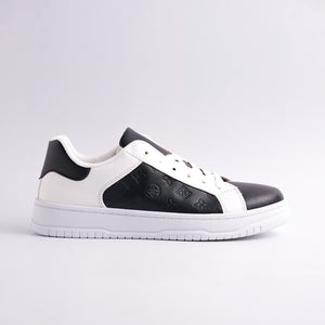 Black and white sneaker on a light gray background