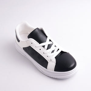 Black and white sneaker on a light gray background