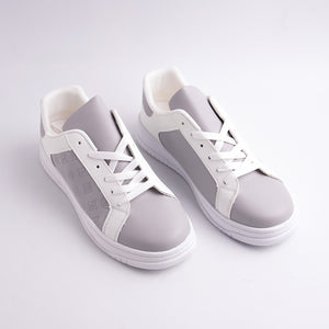 White and gray sneakers on a light gray background