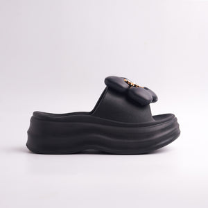 Side profile of the Black Platform Flower Slide showing the chunky sole and floral detail.