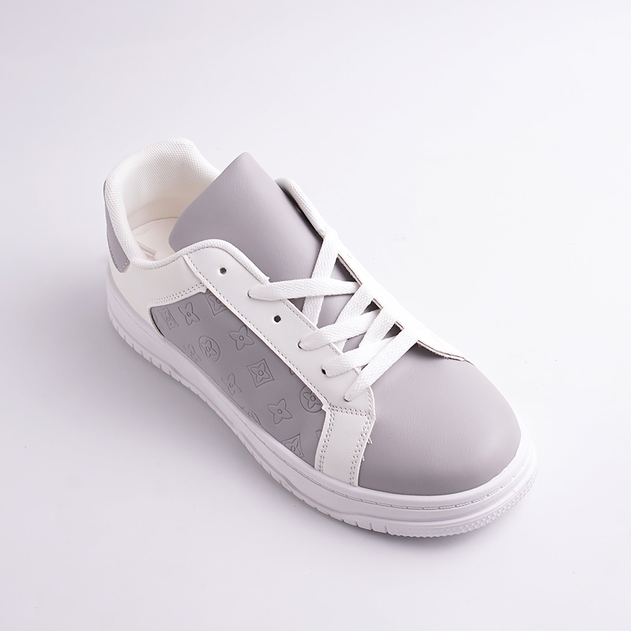 White and gray sneaker on a light gray background
