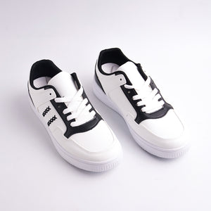 White sneakers with black accents on a light gray background