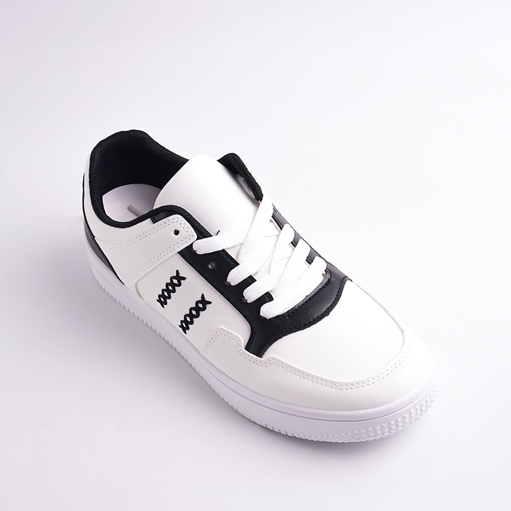 White sneaker with black accents on a light gray background