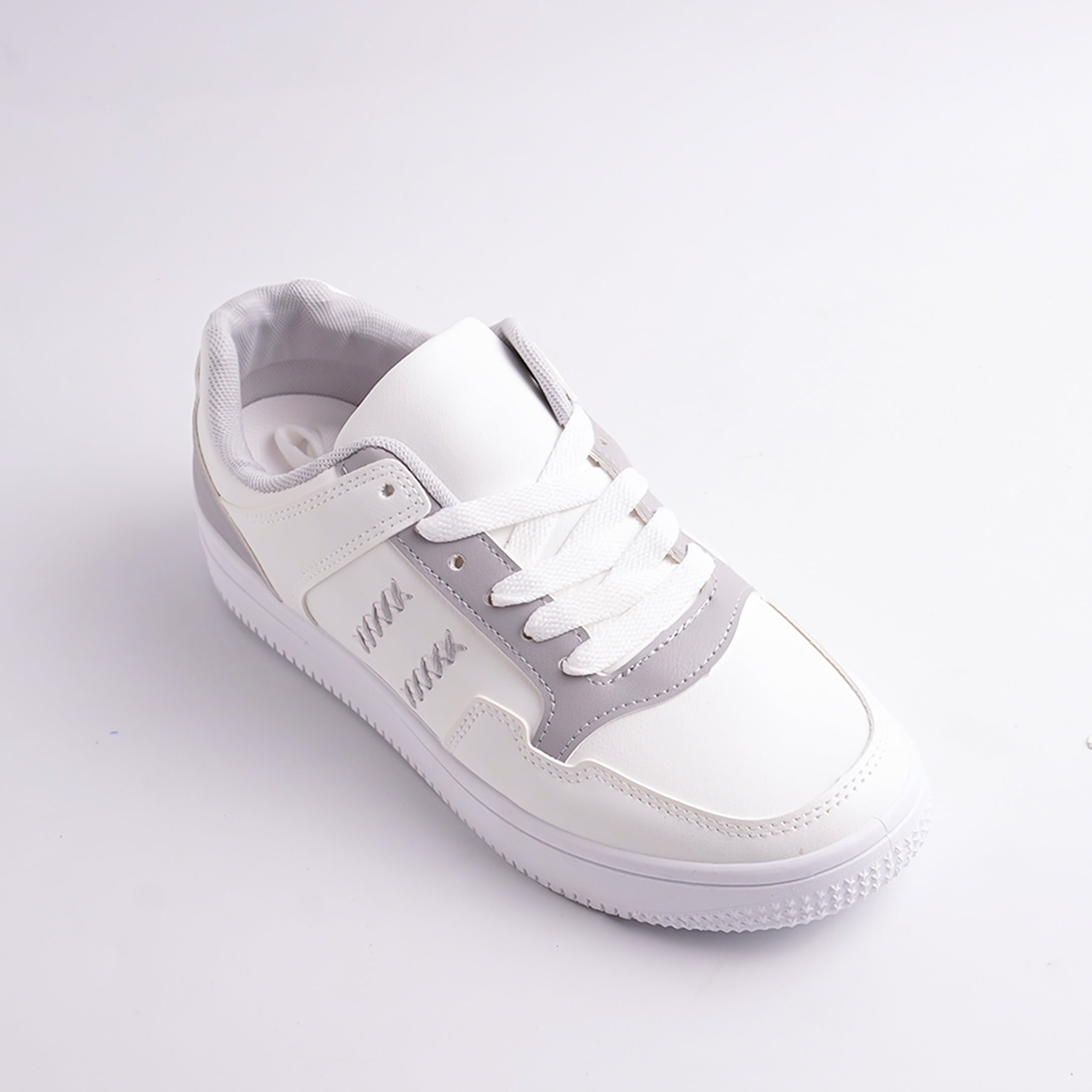 White sneaker on a light gray background