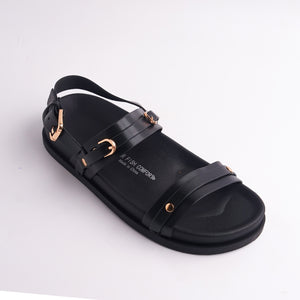 Close-up of Black Water Fish Comfort sandal showing the double strap and gold studs.