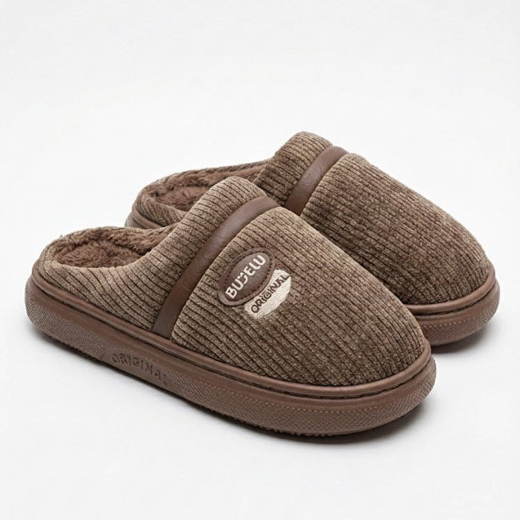 Pair of brown slippers on a white background