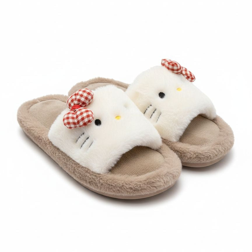 Pair of plush slippers with a cat design on a white background