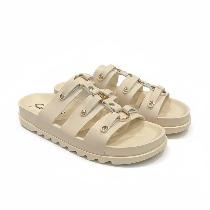Beige sandals with strap details on a white background